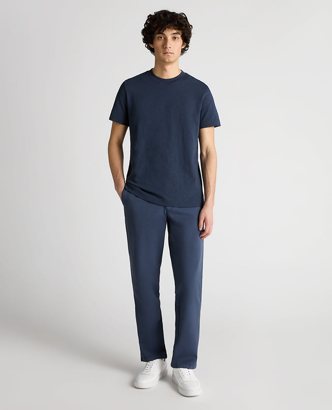 Man wearing a navy Tapered Fit Cotton Crew Neck Tee