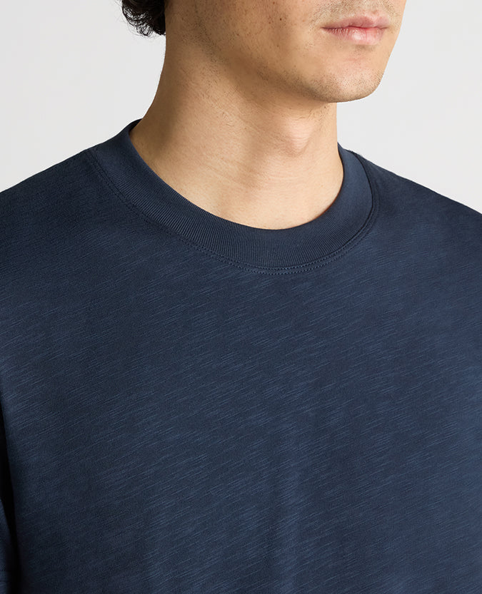 Man wearing a navy Tapered Fit Cotton Crew Neck Tee