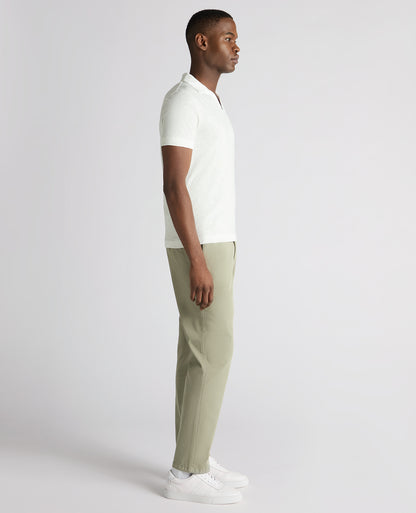 Man wearing a white Tapered Fit Open Collar Cotton Polo