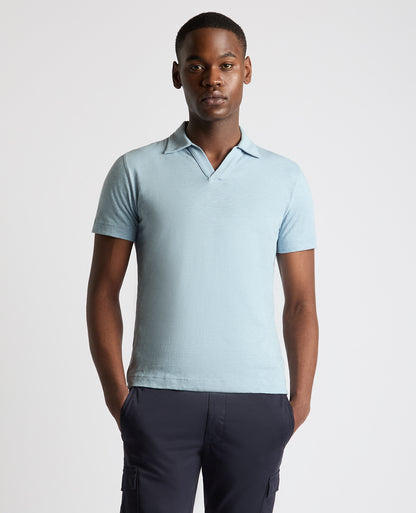 Man wearing a blue Tapered Fit Open Collar Cotton Polo
