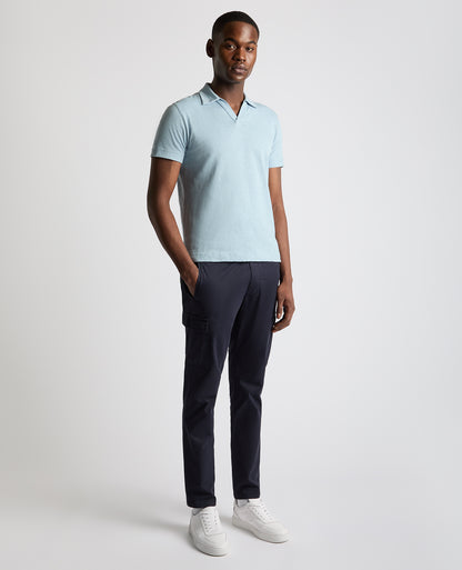 Man wearing a blue Tapered Fit Open Collar Cotton Polo