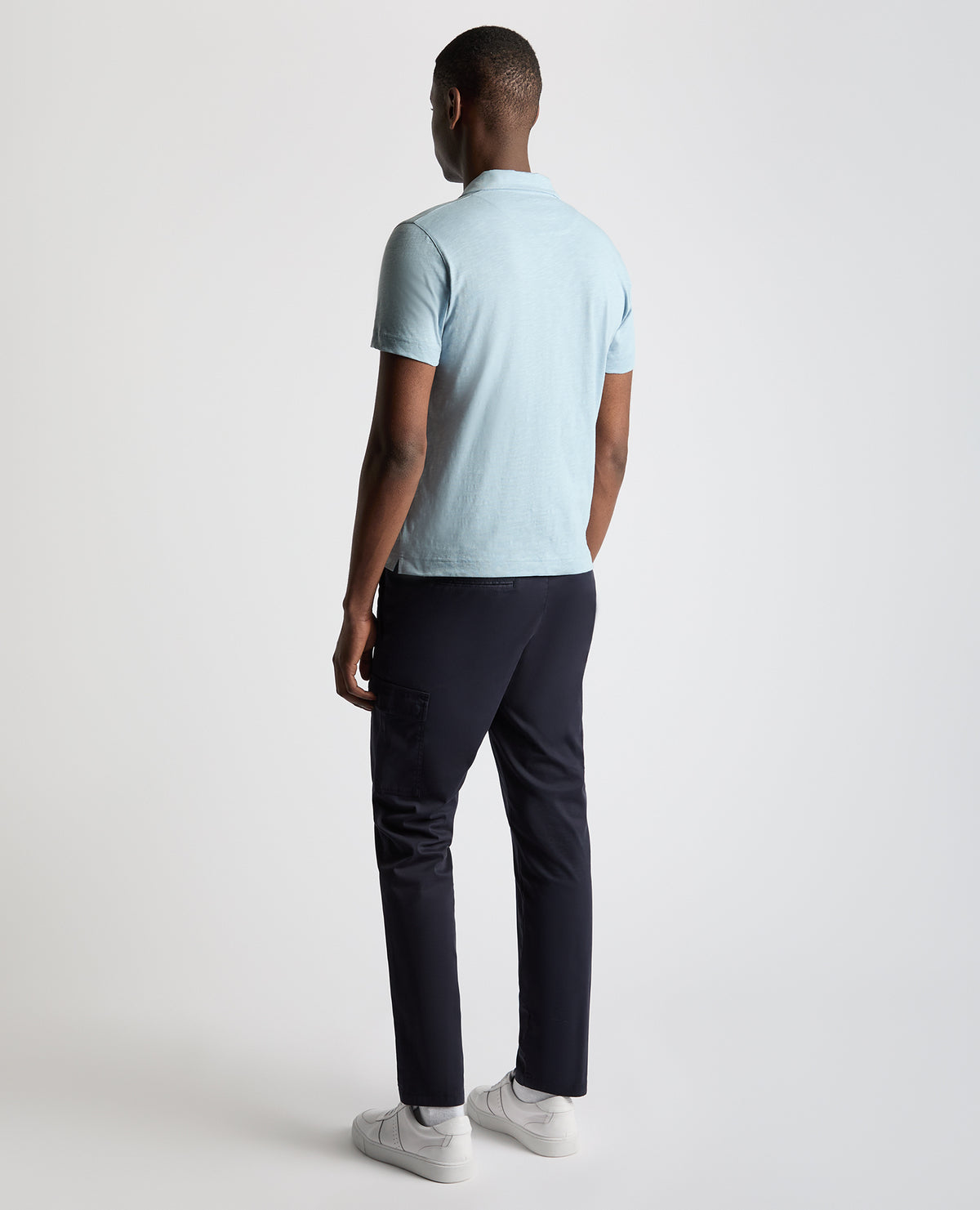 Man wearing a blue Tapered Fit Open Collar Cotton Polo