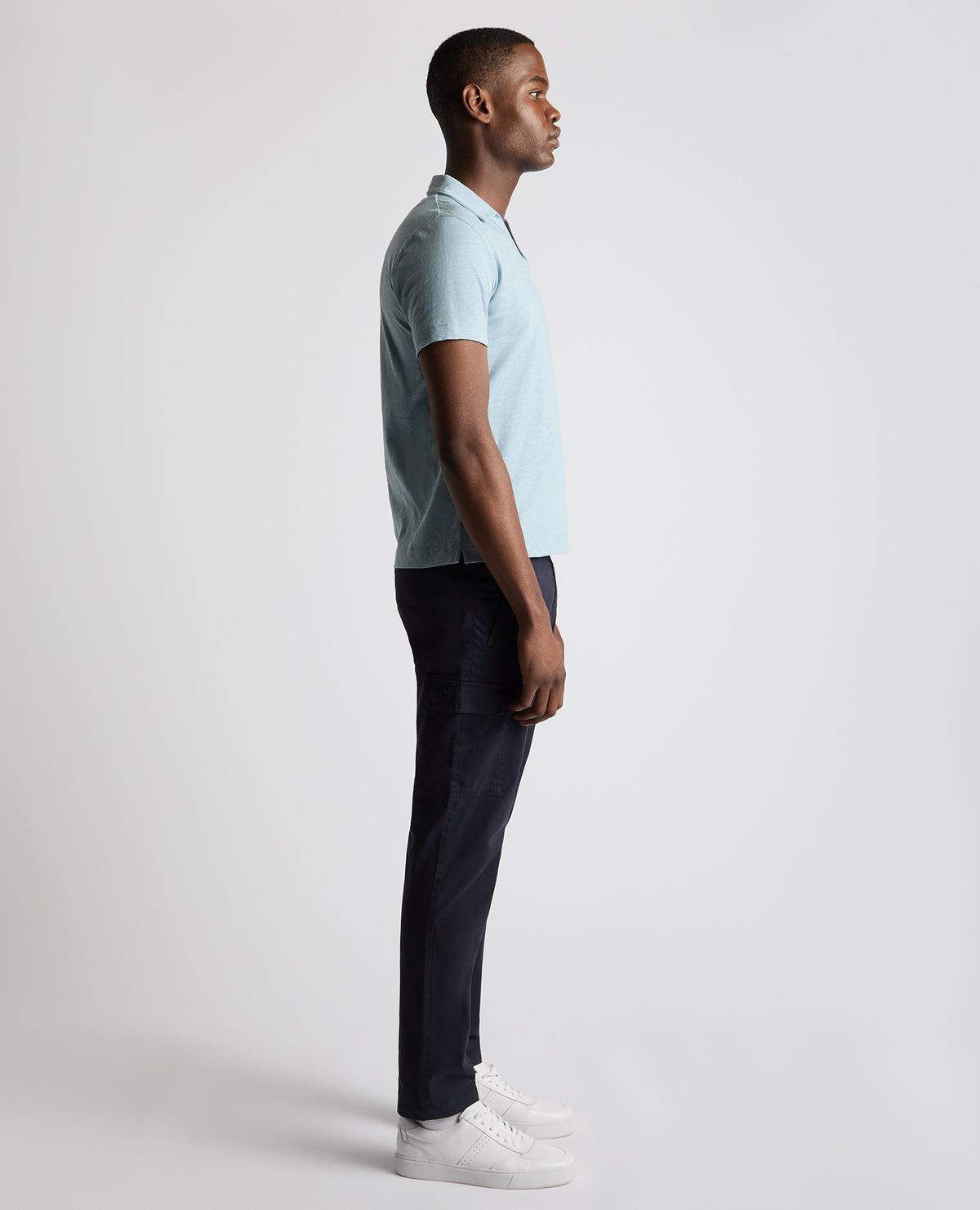 Man wearing a blue Tapered Fit Open Collar Cotton Polo