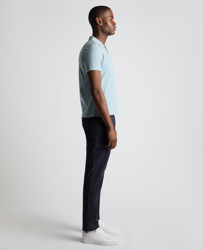 Man wearing a blue Tapered Fit Open Collar Cotton Polo