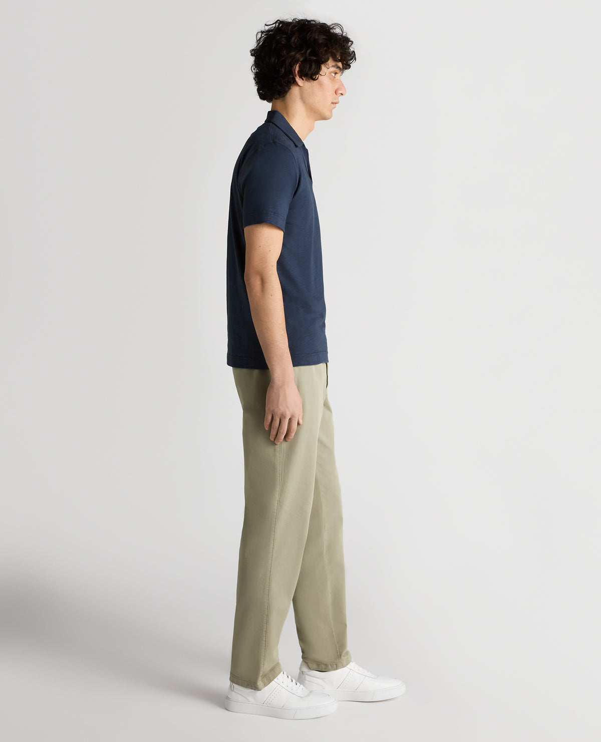 Man wearing a navy Tapered Fit Open Collar Cotton Polo