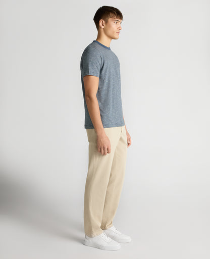 Man wearing a blue Tapered Fit Cotton-Linen T-Shirt