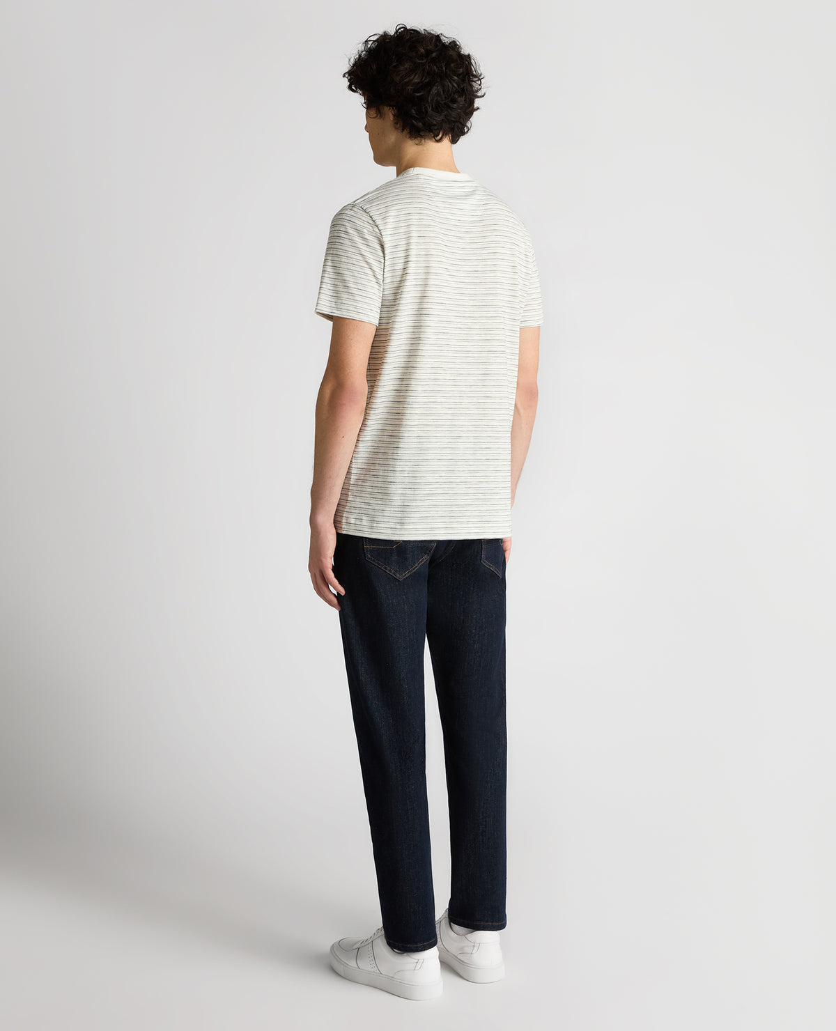Man wearing a navy Relaxed Fit Cotton Stripe T-Shirt