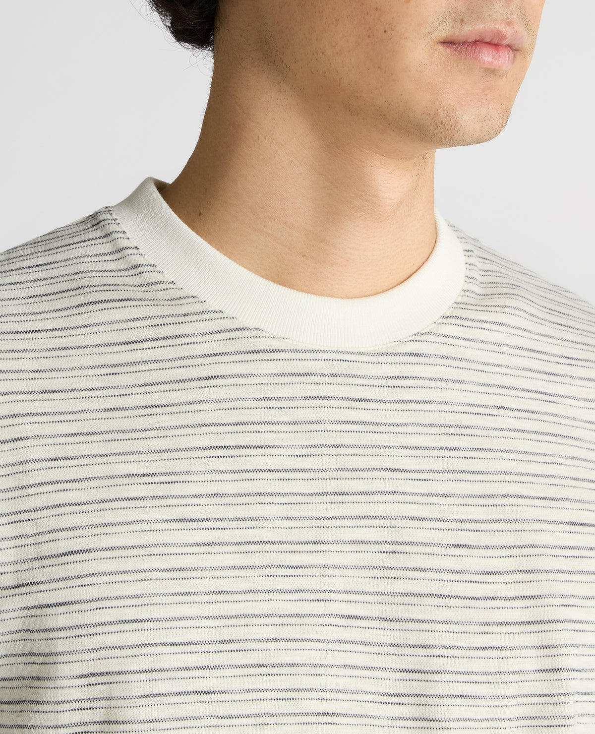 Man wearing a navy Relaxed Fit Cotton Stripe T-Shirt