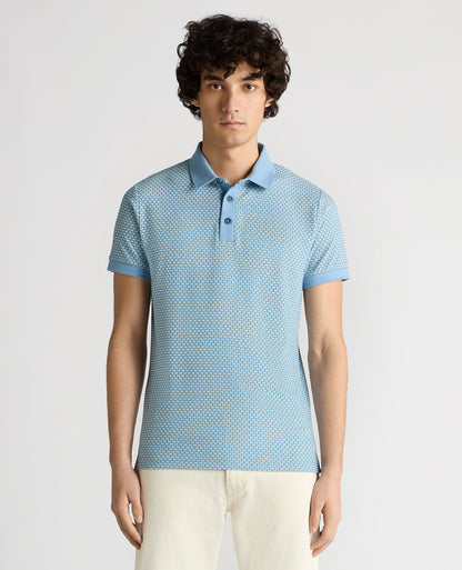 Man wearing a blue Tapered Fit Basket Weave Polo Shirt
