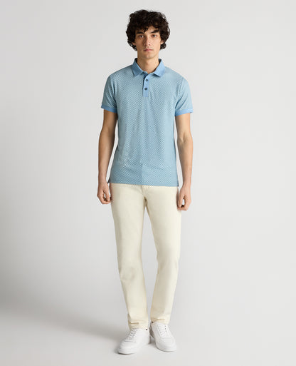 Man wearing a blue Tapered Fit Basket Weave Polo Shirt