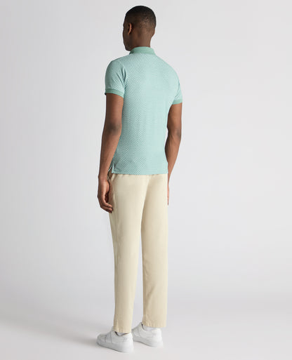 Man wearing a green Tapered Fit Cotton-Blend Polo Shirt