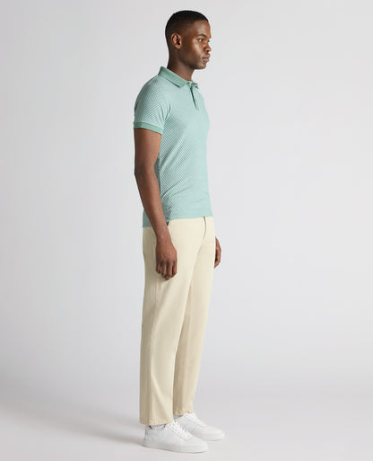 Man wearing a green Tapered Fit Cotton-Blend Polo Shirt