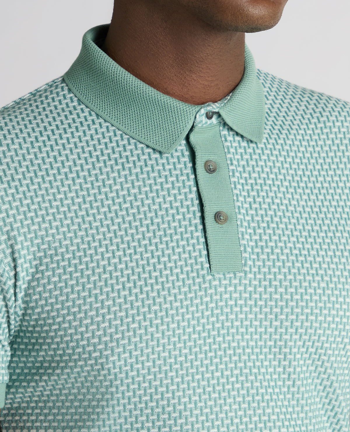 Man wearing a green Tapered Fit Cotton-Blend Polo Shirt