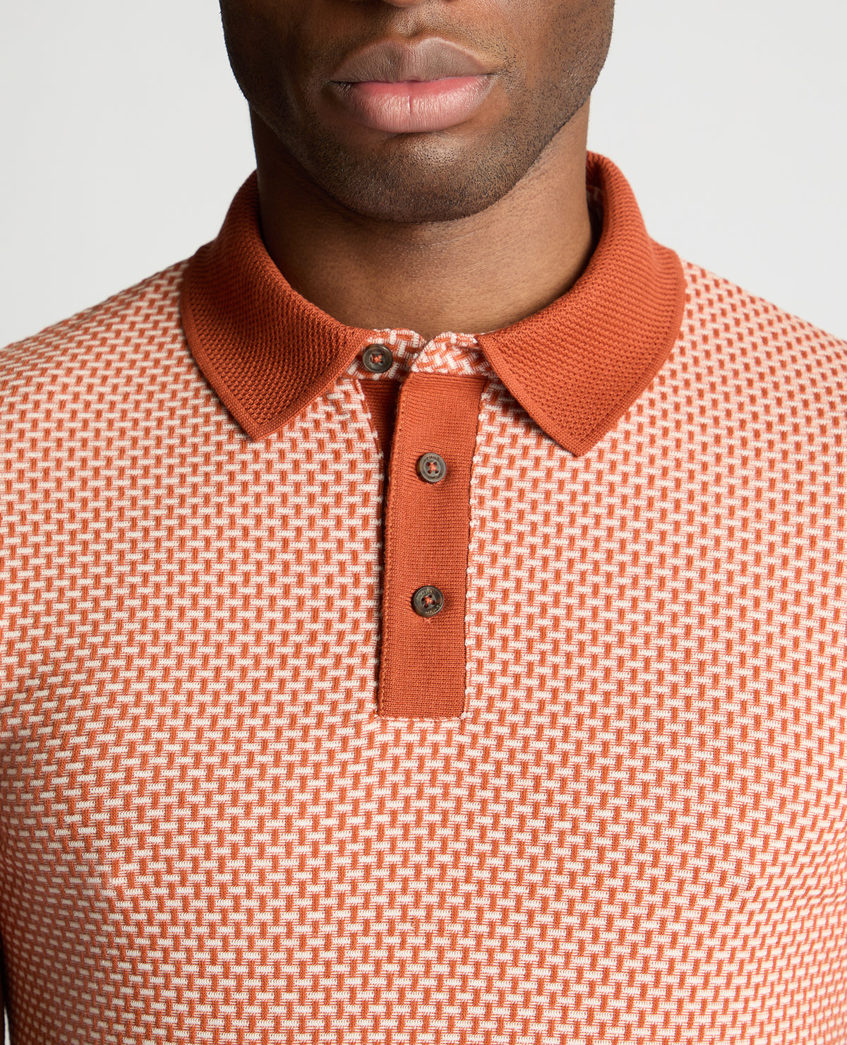 Man wearing a orange jumper