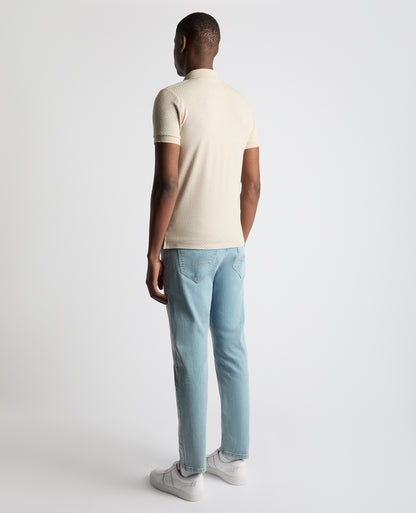 Man wearing a sand Tapered Fit Cotton-Blend Polo Shirt