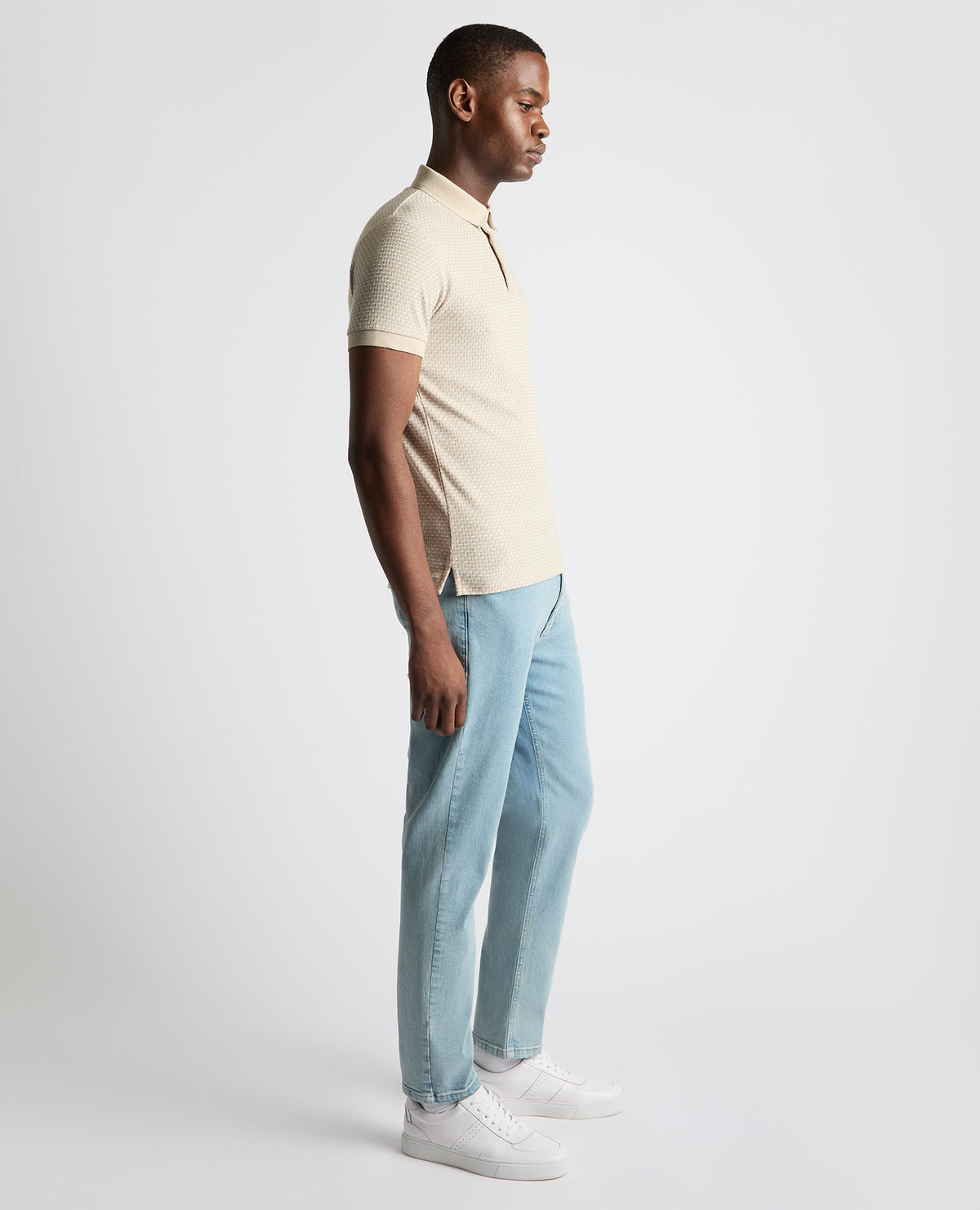 Man wearing a sand Tapered Fit Cotton-Blend Polo Shirt