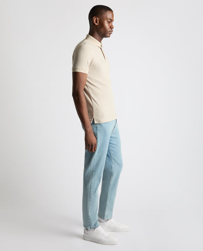 Man wearing a sand Tapered Fit Cotton-Blend Polo Shirt