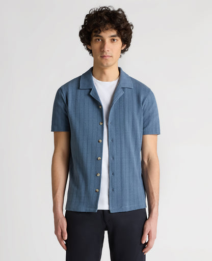 Man wearing a blue Relaxed Fit Cotton-Linen Cuban Collar Shirt