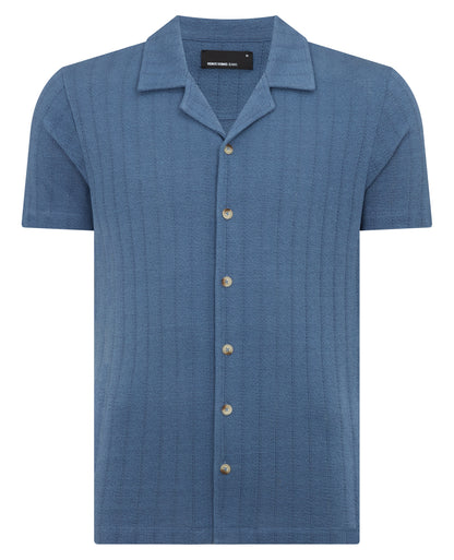 Man wearing a blue Relaxed Fit Cotton-Linen Cuban Collar Shirt