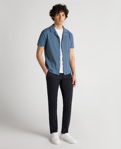 Man wearing a blue Relaxed Fit Cotton-Linen Cuban Collar Shirt