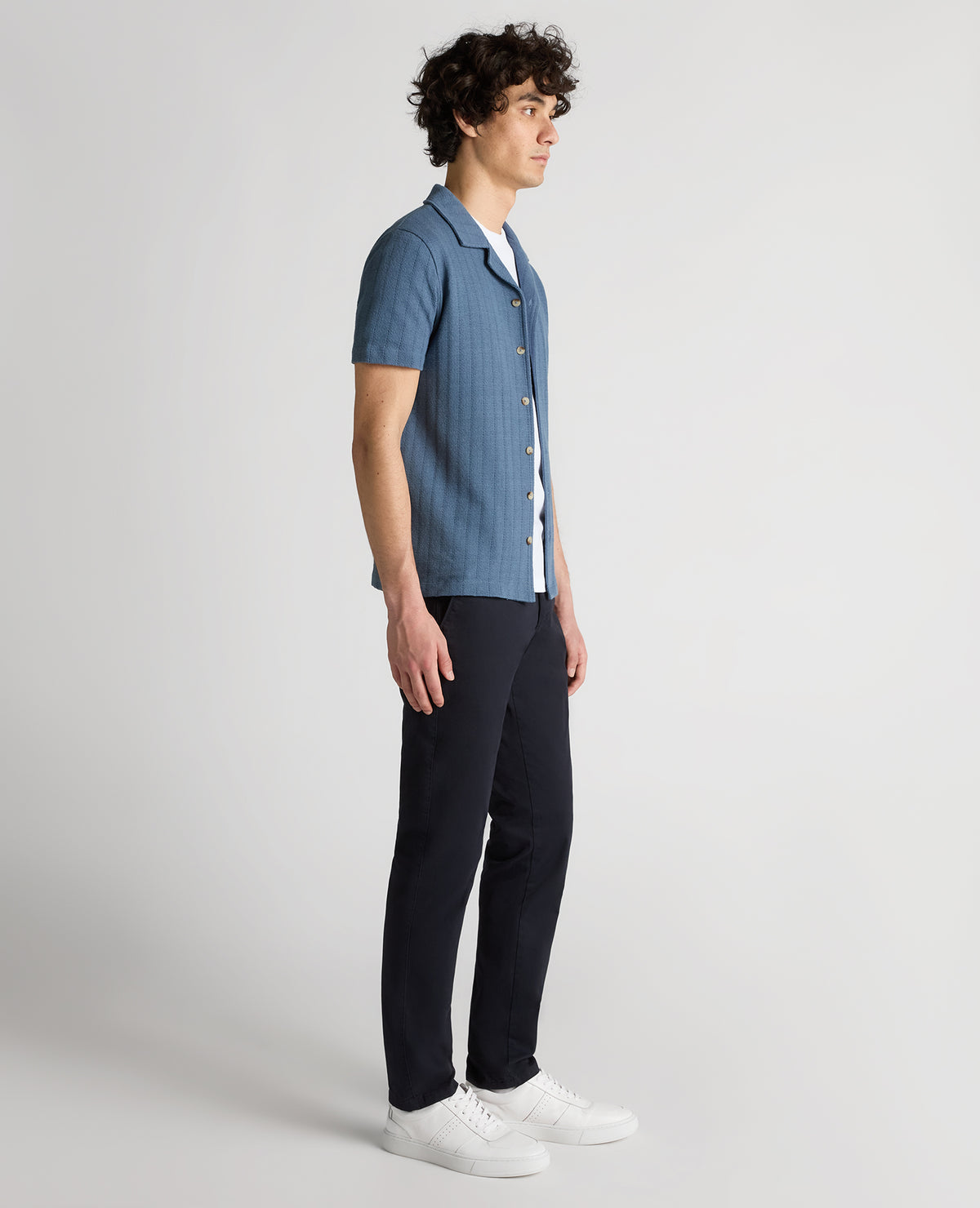 Man wearing a blue Relaxed Fit Cotton-Linen Cuban Collar Shirt