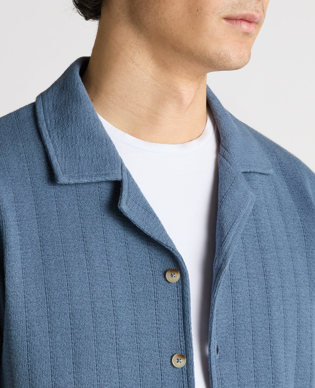 Man wearing a blue Relaxed Fit Cotton-Linen Cuban Collar Shirt