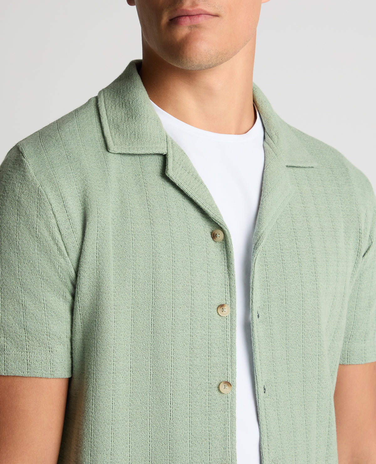 Man wearing a green Relaxed Fit Cotton-Linen Cuban Collar Shirt