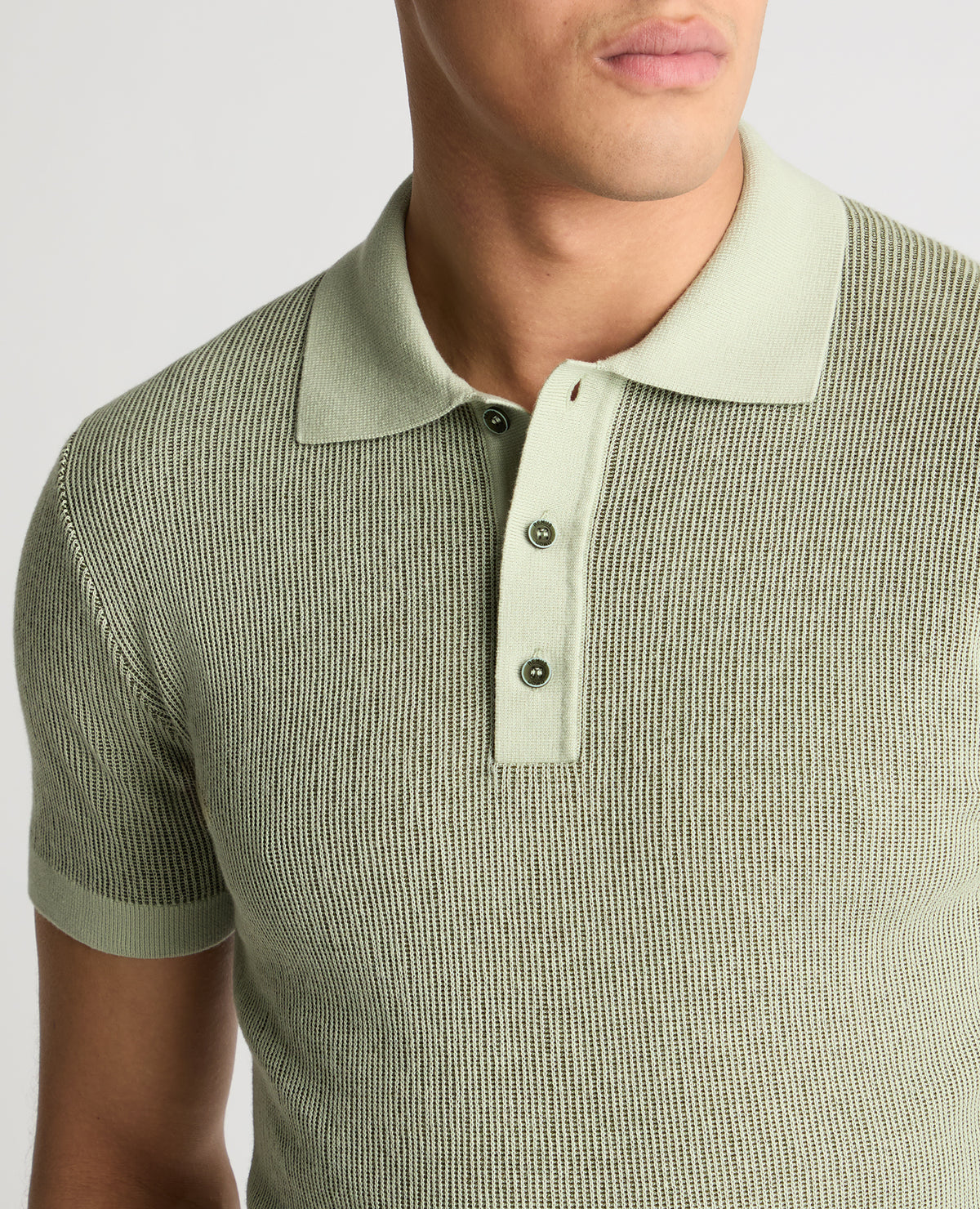 Man wearing a green jumper