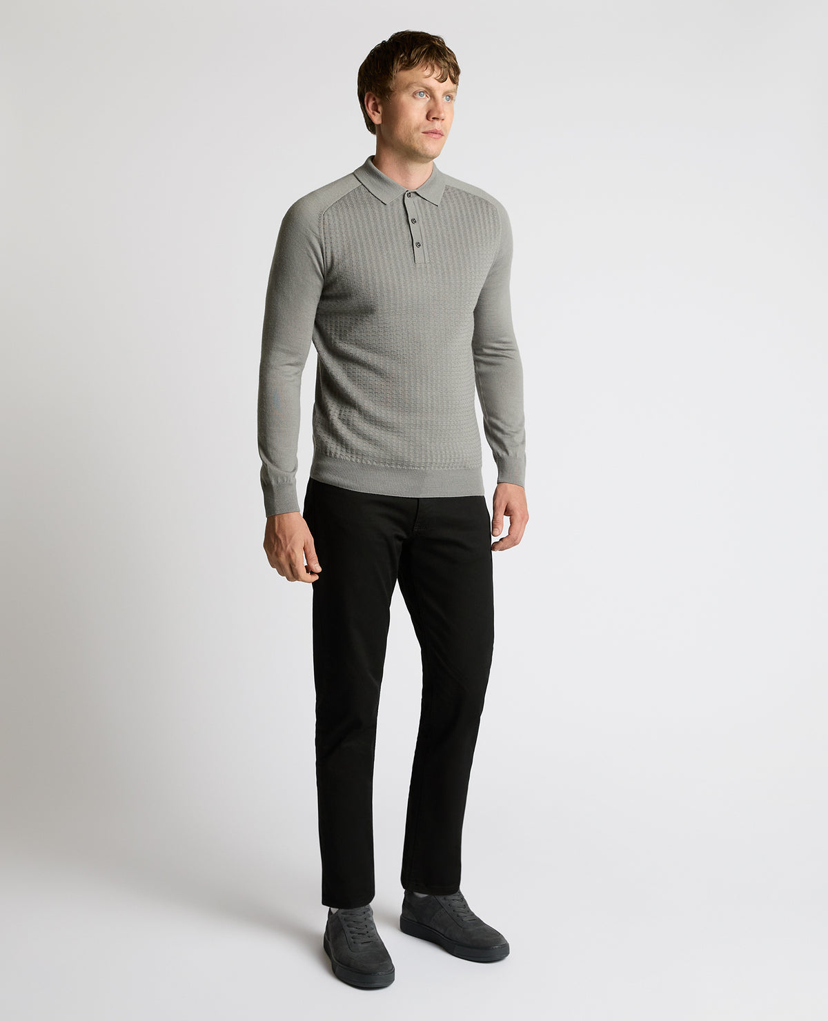 Man wearing a grey Merino Wool-Blend Knit Polo