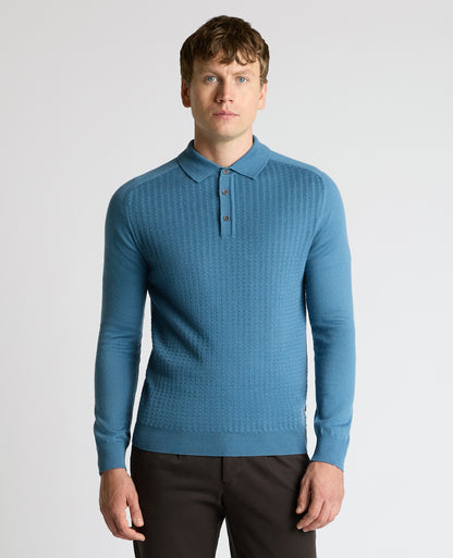 Man wearing a blue Merino Wool-Blend Knit Polo
