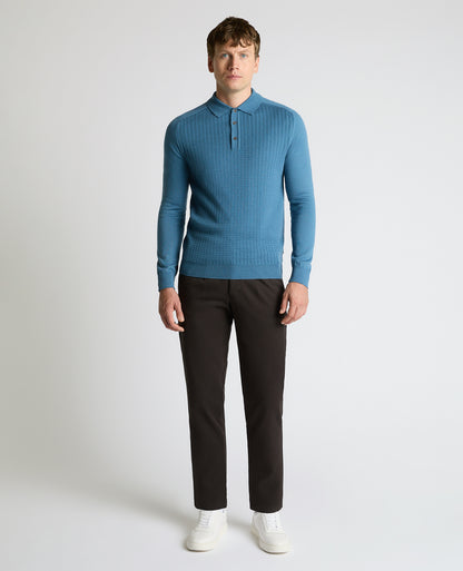 Man wearing a blue Merino Wool-Blend Knit Polo