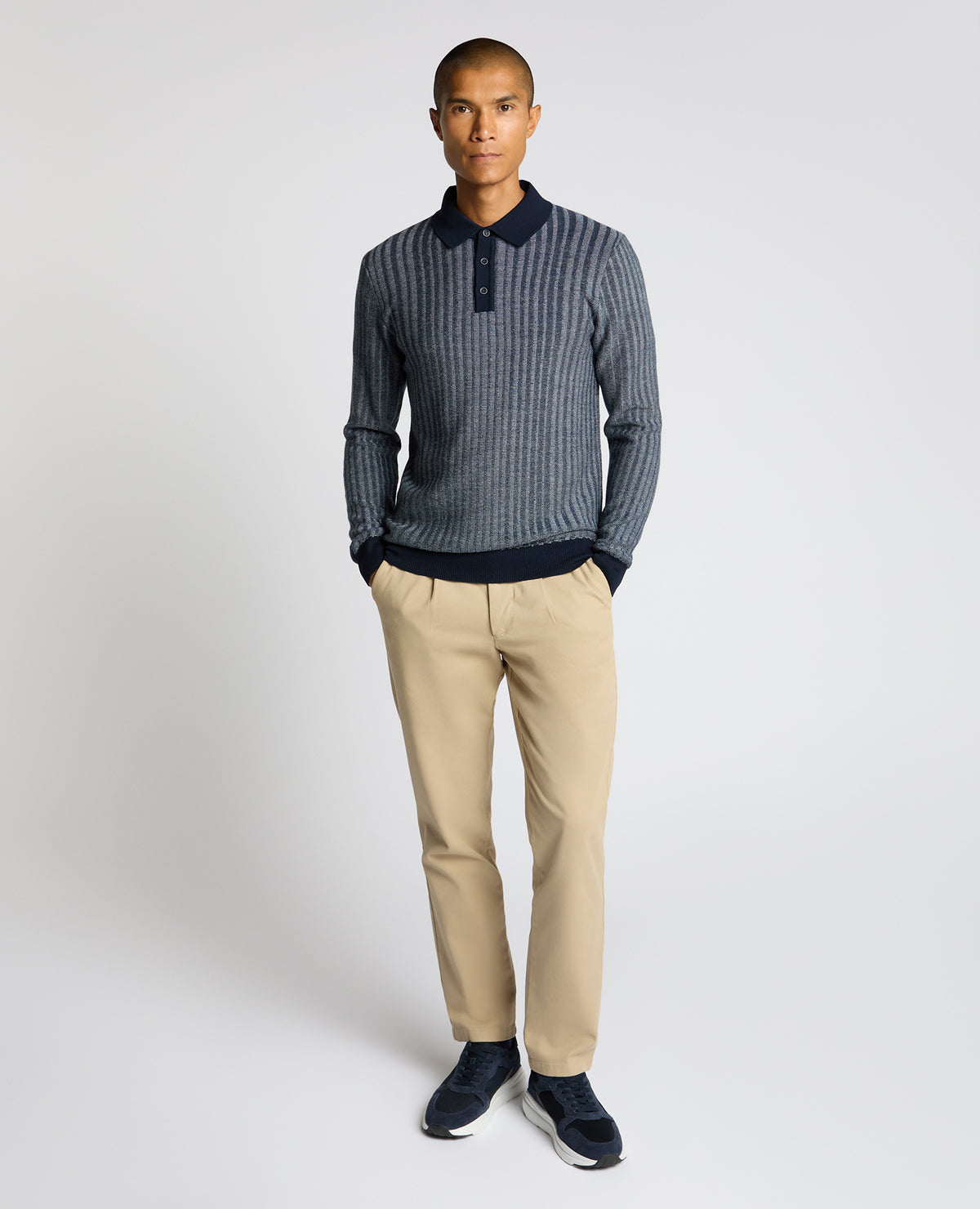 Man wearing a blue Plaited Stripe Wool-Blend Knit Polo