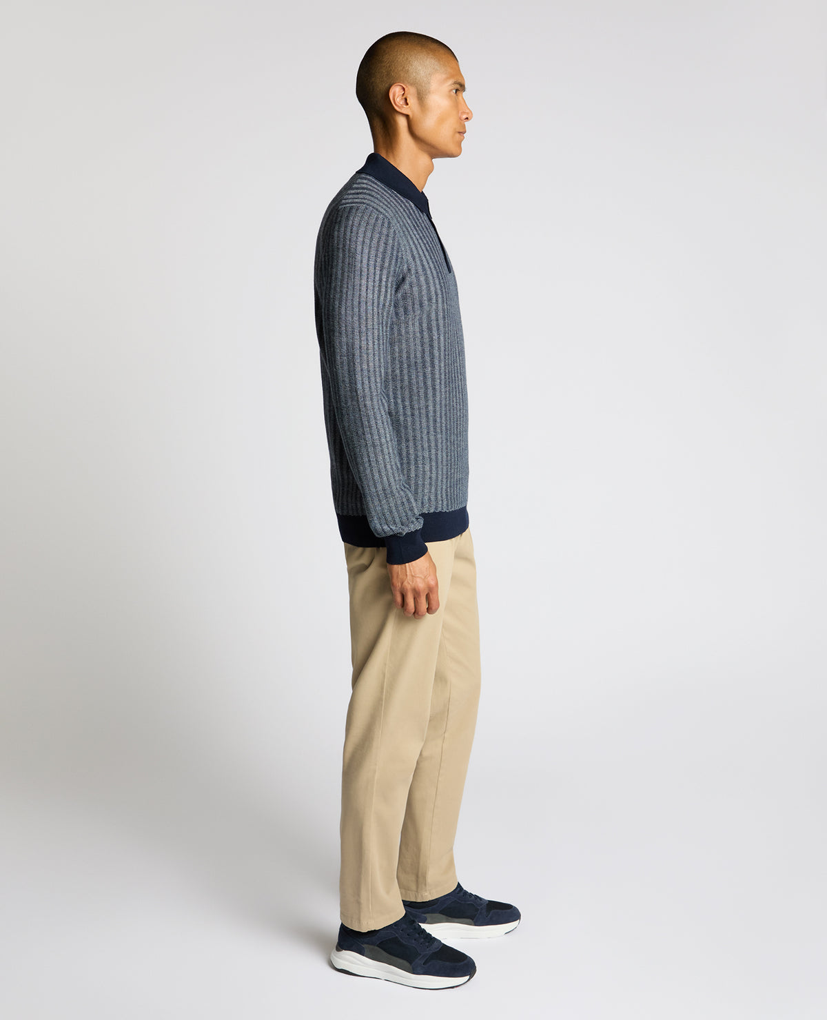 Man wearing a blue Plaited Stripe Wool-Blend Knit Polo