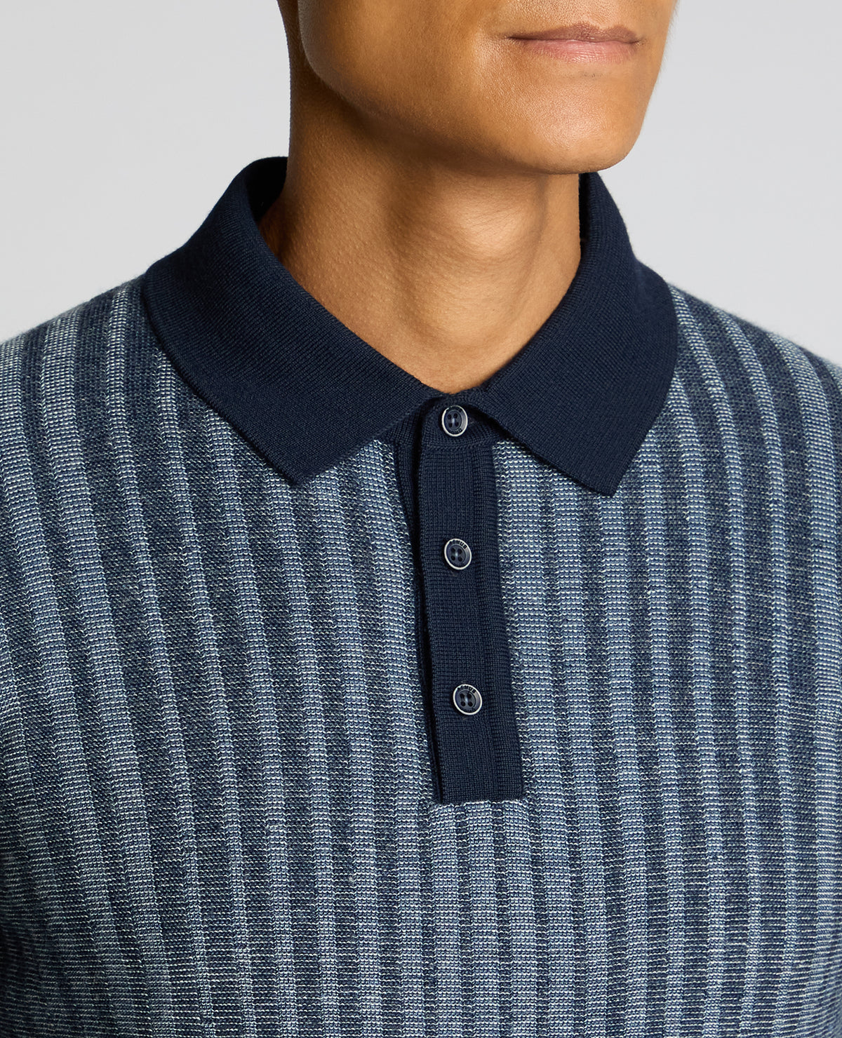Man wearing a blue Plaited Stripe Wool-Blend Knit Polo