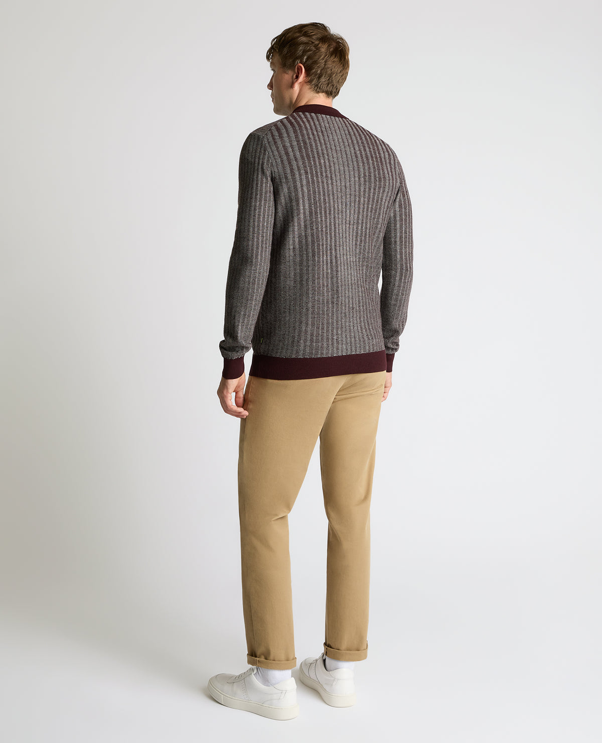 Man wearing a red Plaited Stripe Wool-Blend Knit Polo