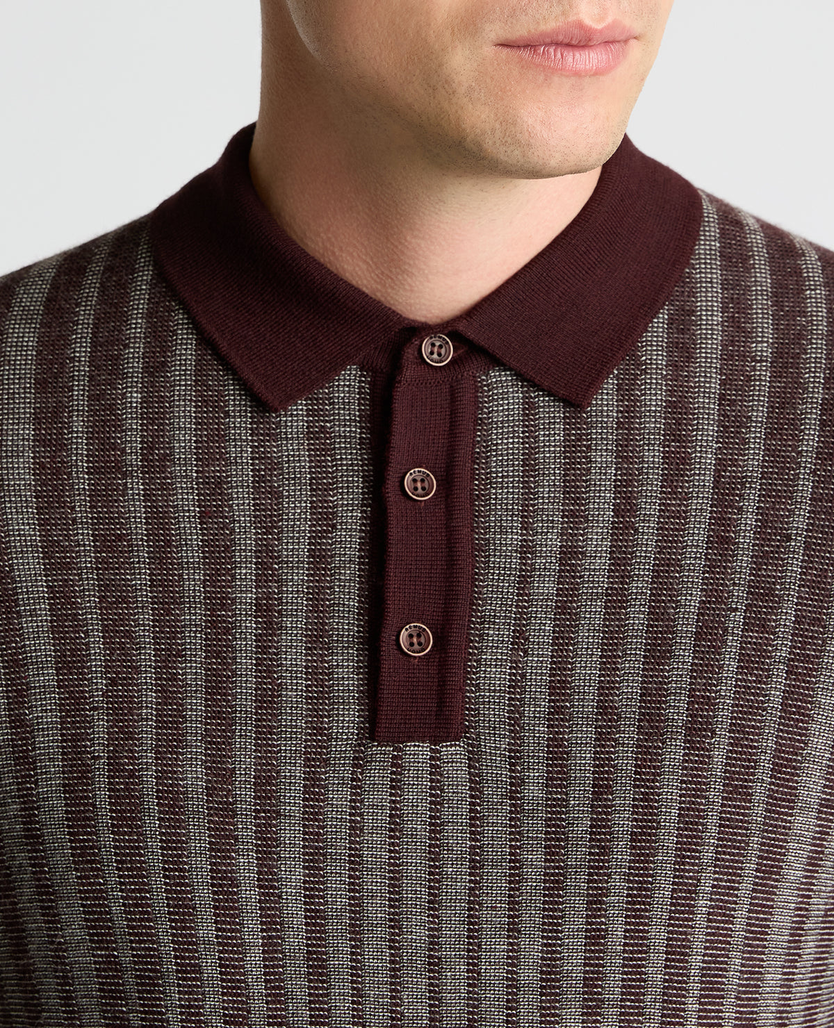 Man wearing a red Plaited Stripe Wool-Blend Knit Polo