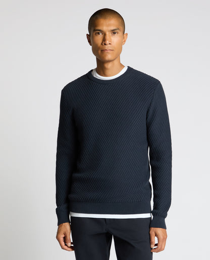 Man wearing a blue Cotton Interest Fabric Sweater
