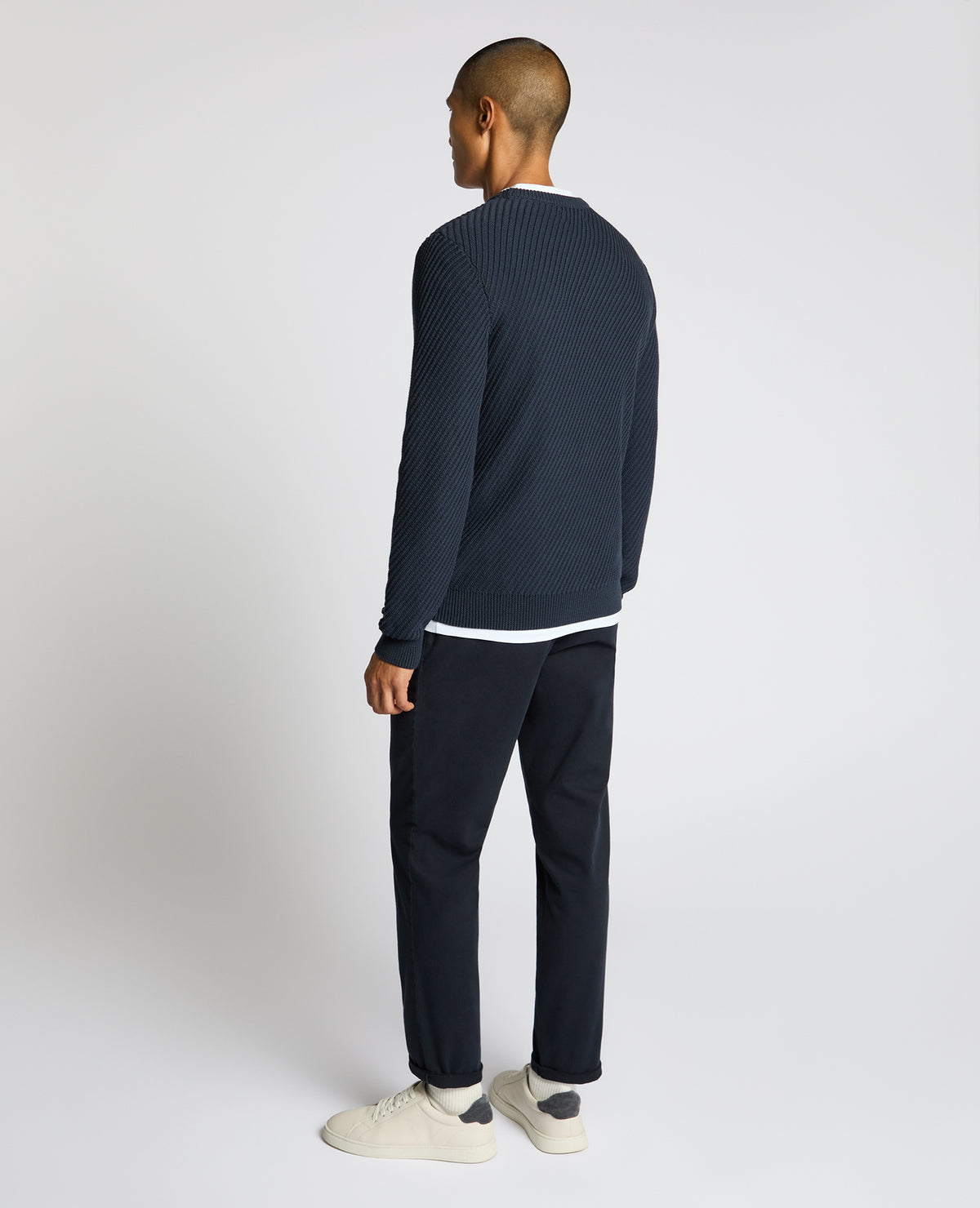 Man wearing a blue Cotton Interest Fabric Sweater