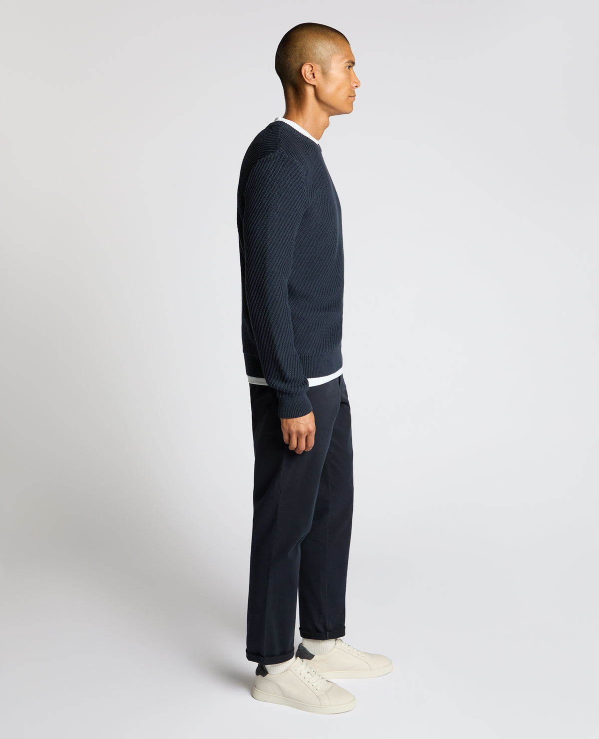 Man wearing a blue Cotton Interest Fabric Sweater