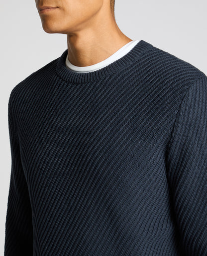 Man wearing a blue Cotton Interest Fabric Sweater