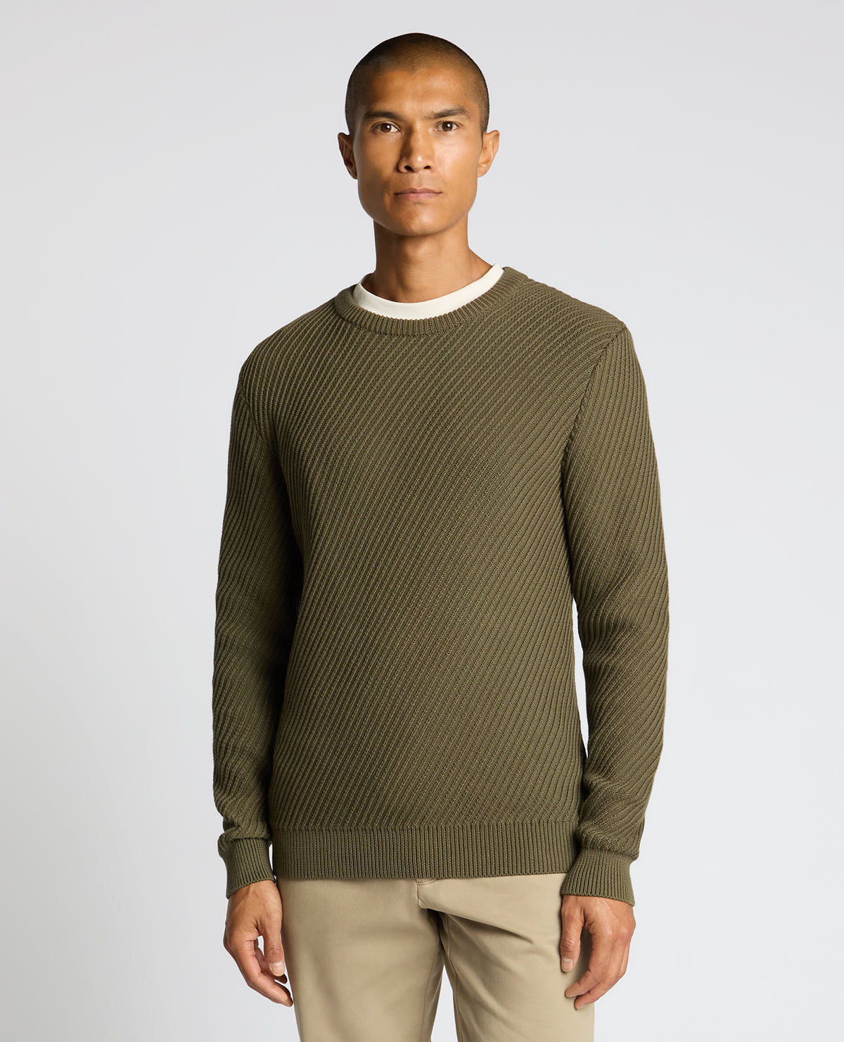 Man wearing a green Cotton Interest Fabric Sweater