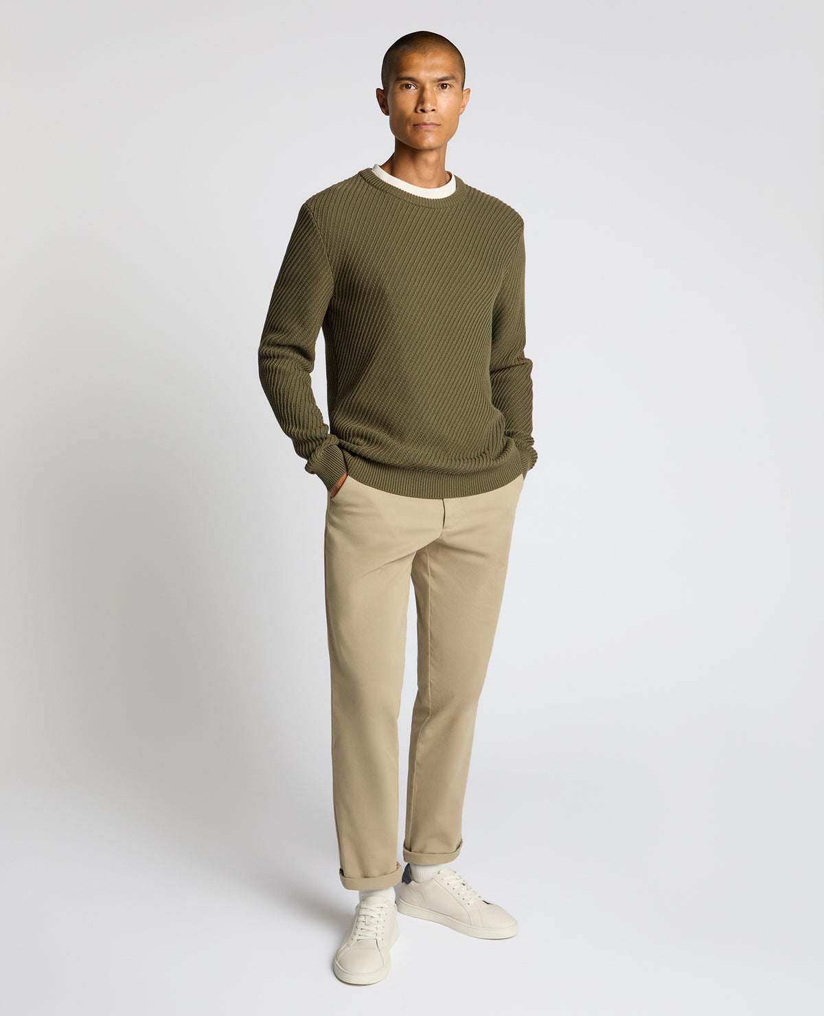 Man wearing a green Cotton Interest Fabric Sweater