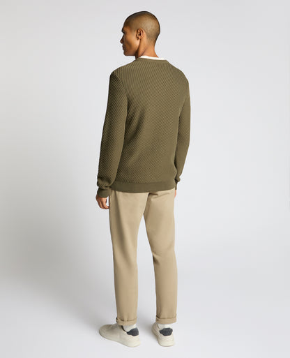 Man wearing a green Cotton Interest Fabric Sweater