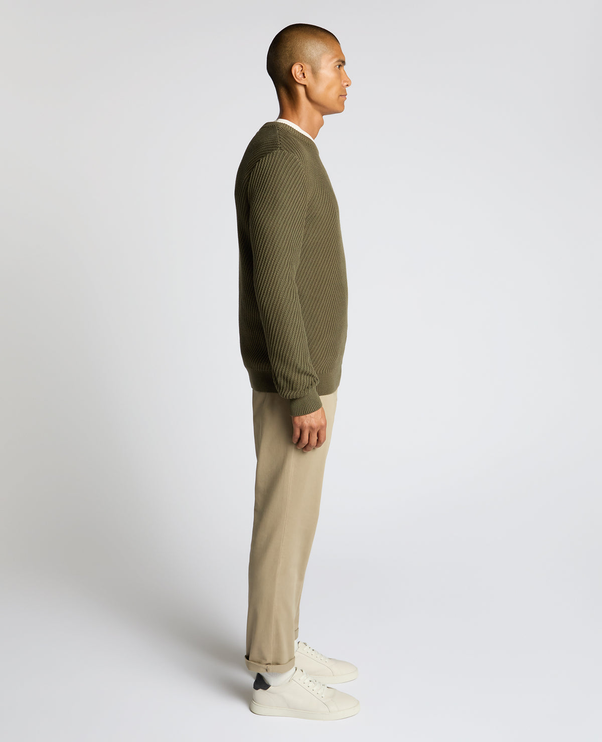 Man wearing a green Cotton Interest Fabric Sweater