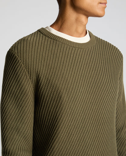 Man wearing a green Cotton Interest Fabric Sweater