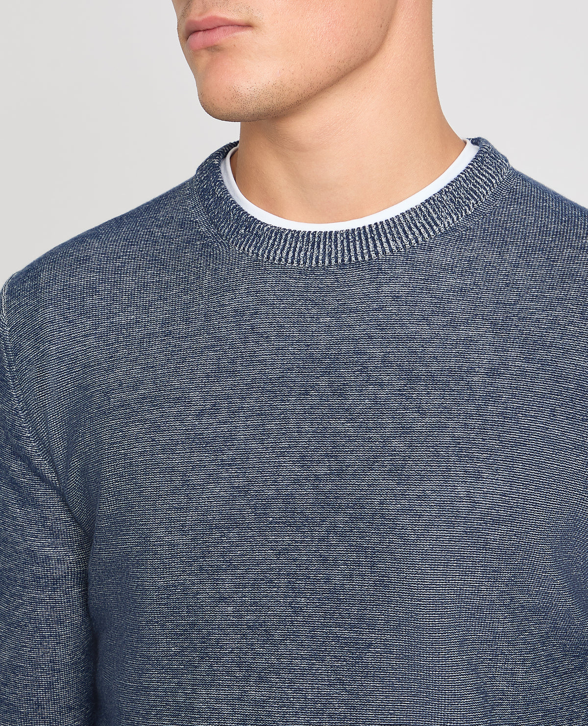 Man wearing a blue jumper