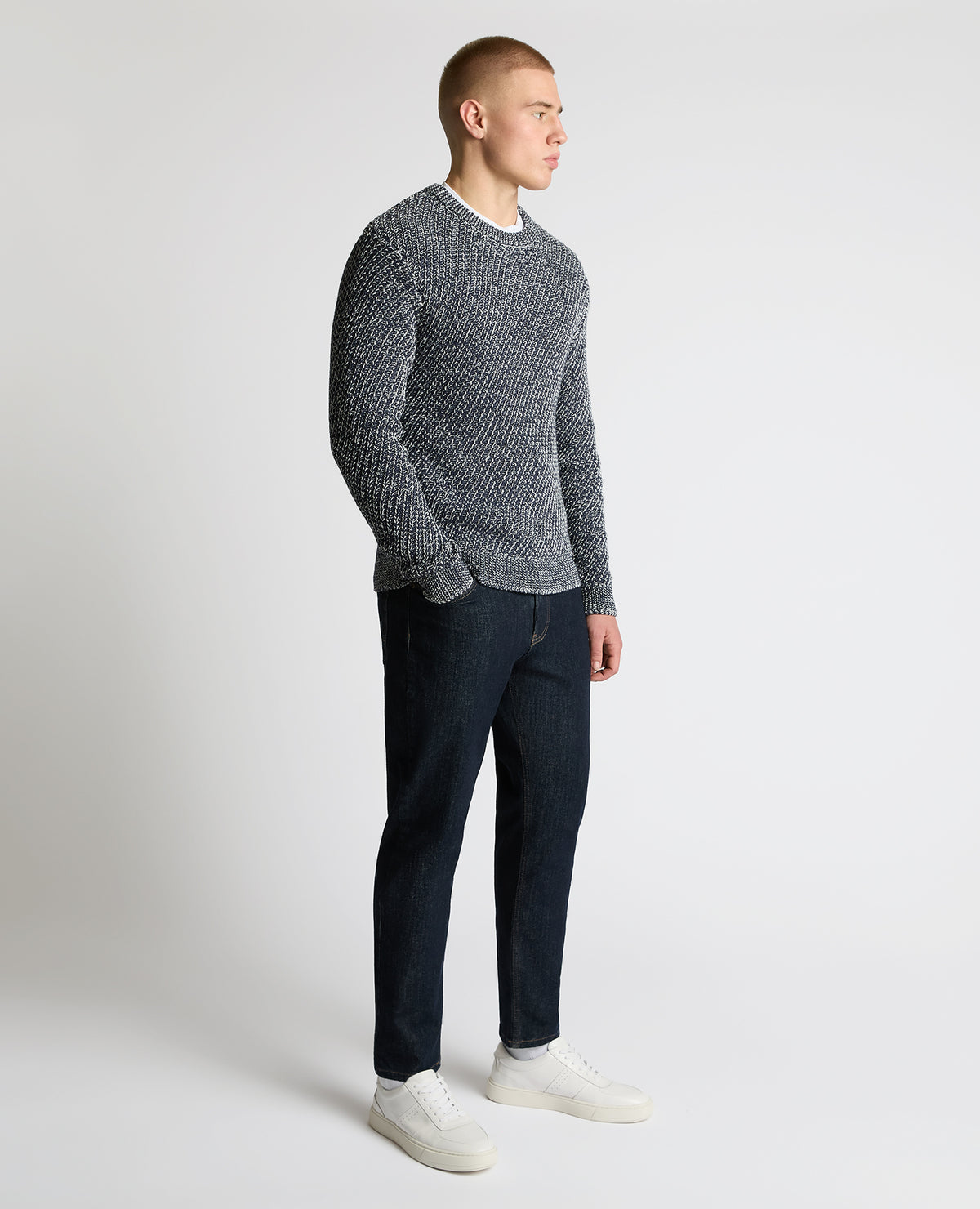 Man wearing a blue Two-Tone Cotton-Blend Knit Sweater