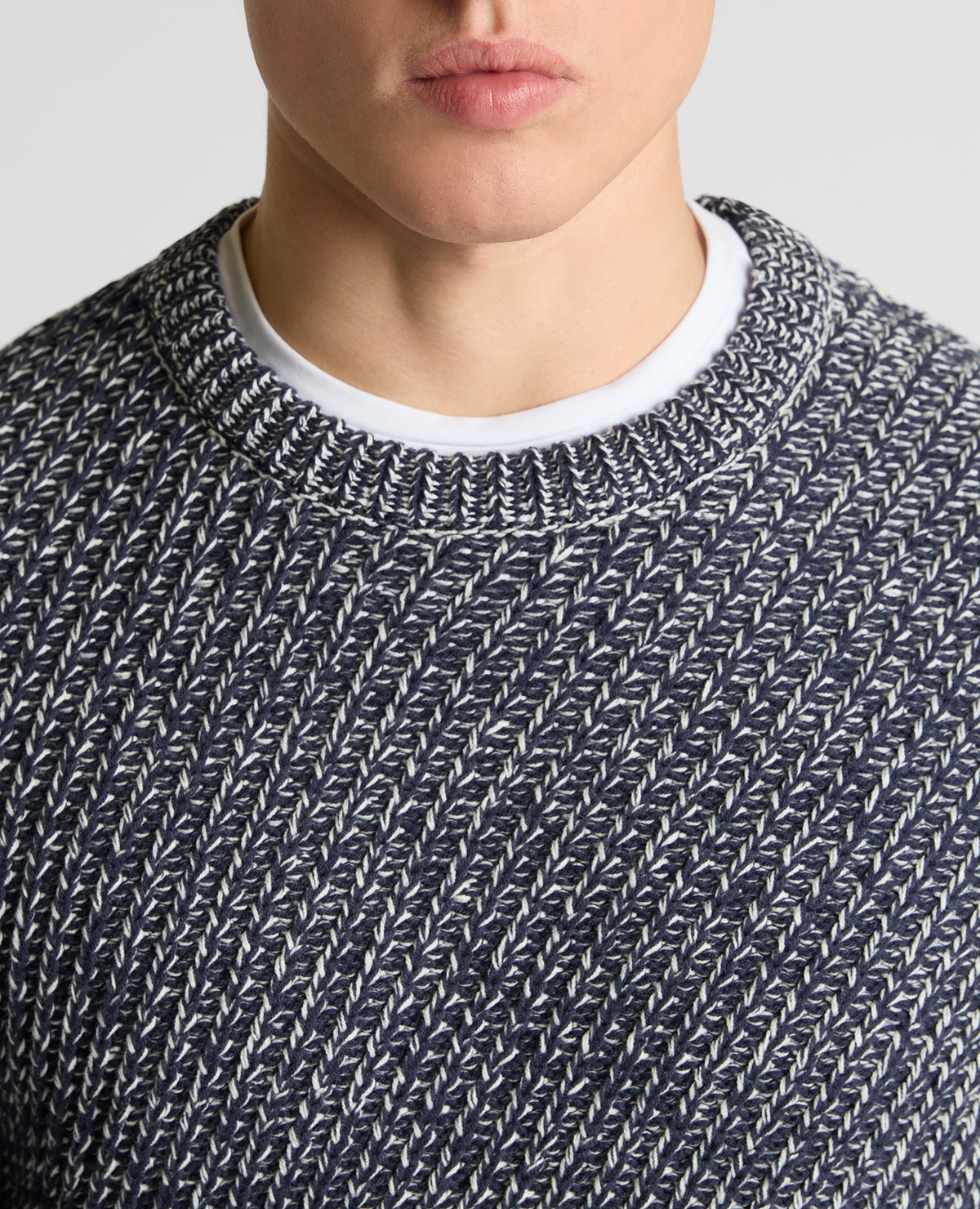 Man wearing a blue Two-Tone Cotton-Blend Knit Sweater