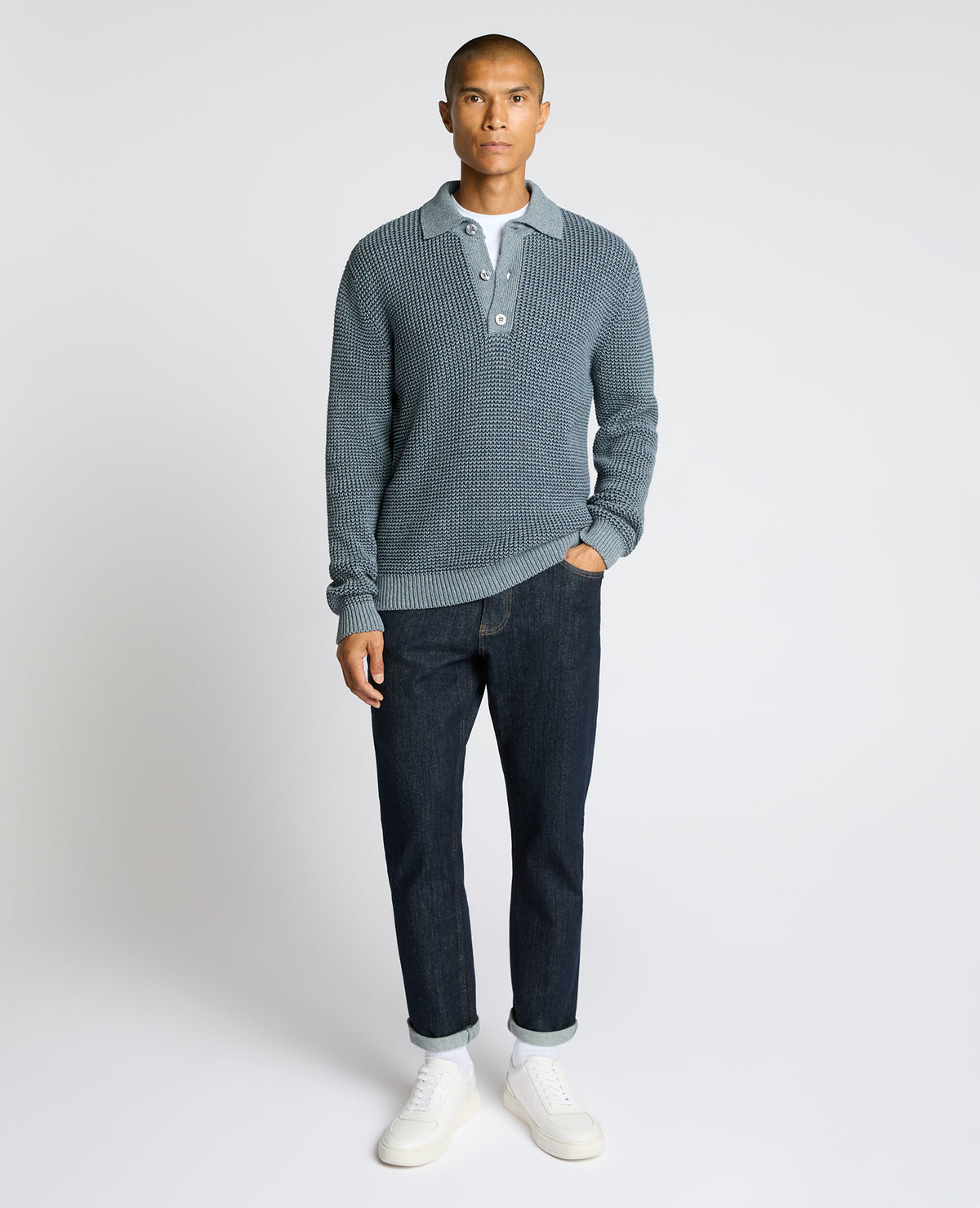 Man wearing a blue Cotton Knit Polo Sweater