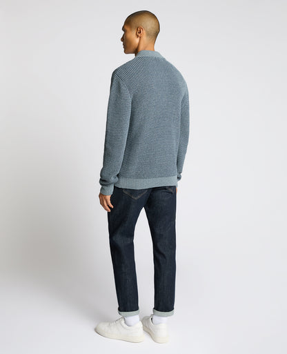 Man wearing a blue Cotton Knit Polo Sweater